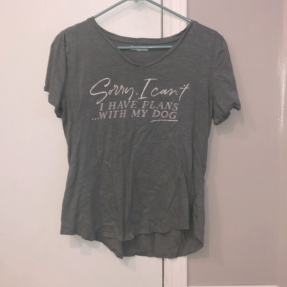 turquoise shirt with white lettering